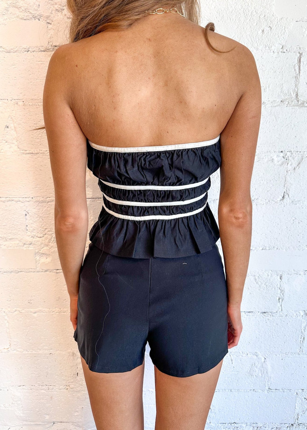 Flattering peplum silhouette for a feminine fit
Classic black color for versatile styling
Structured design for a polished look
Perfect for both casual and formal occasions