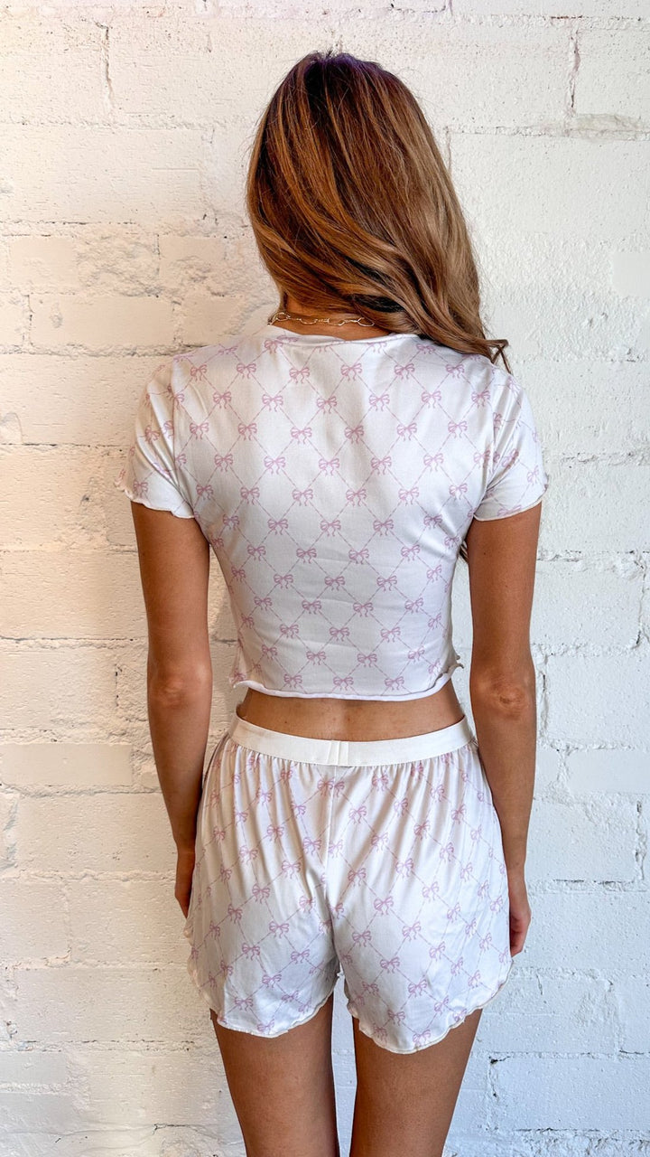 Soft, breathable fabric for ultimate comfort
Relaxed fit for cozy lounging or sleeping
Delicate bow detail for added charm
Feminine pink color for a stylish sleepwear look