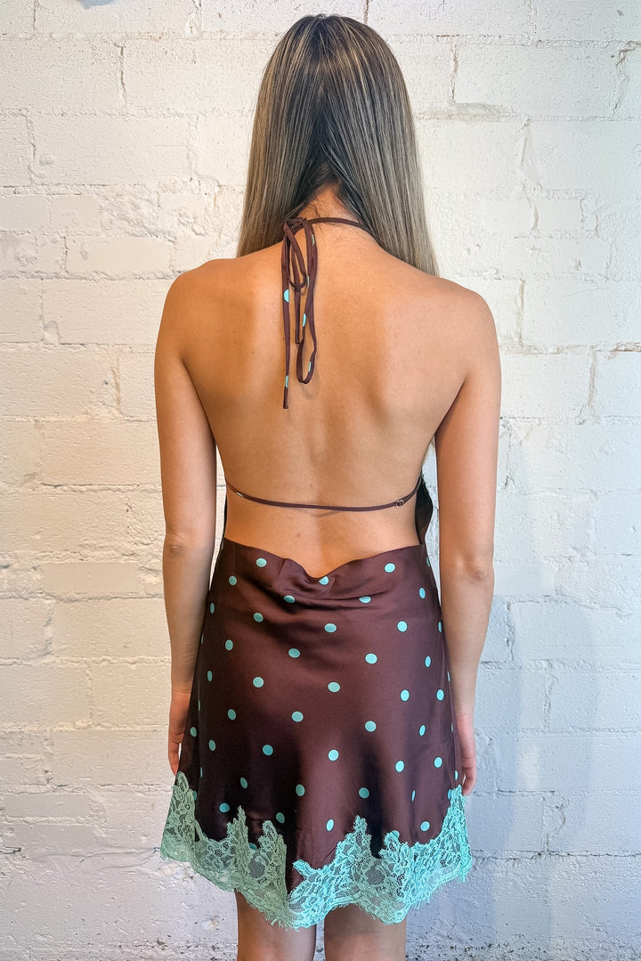 brown mini dress with teal polka dots and lace detailing
